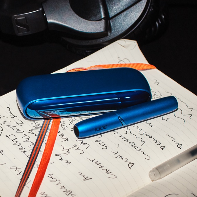 Blue IQOS 3 DUO on notebook